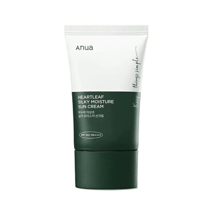 Green sun cream tube with white cap on a white background