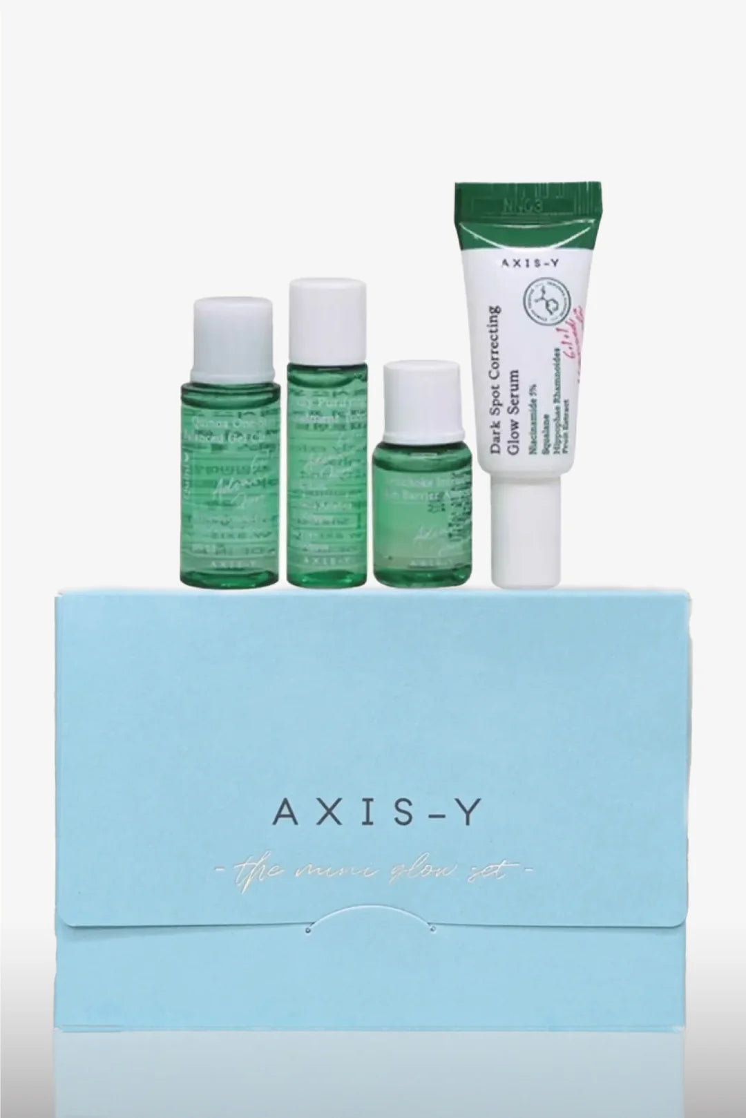 Axis-Y skincare product set with bottles and a tube on a light blue box background