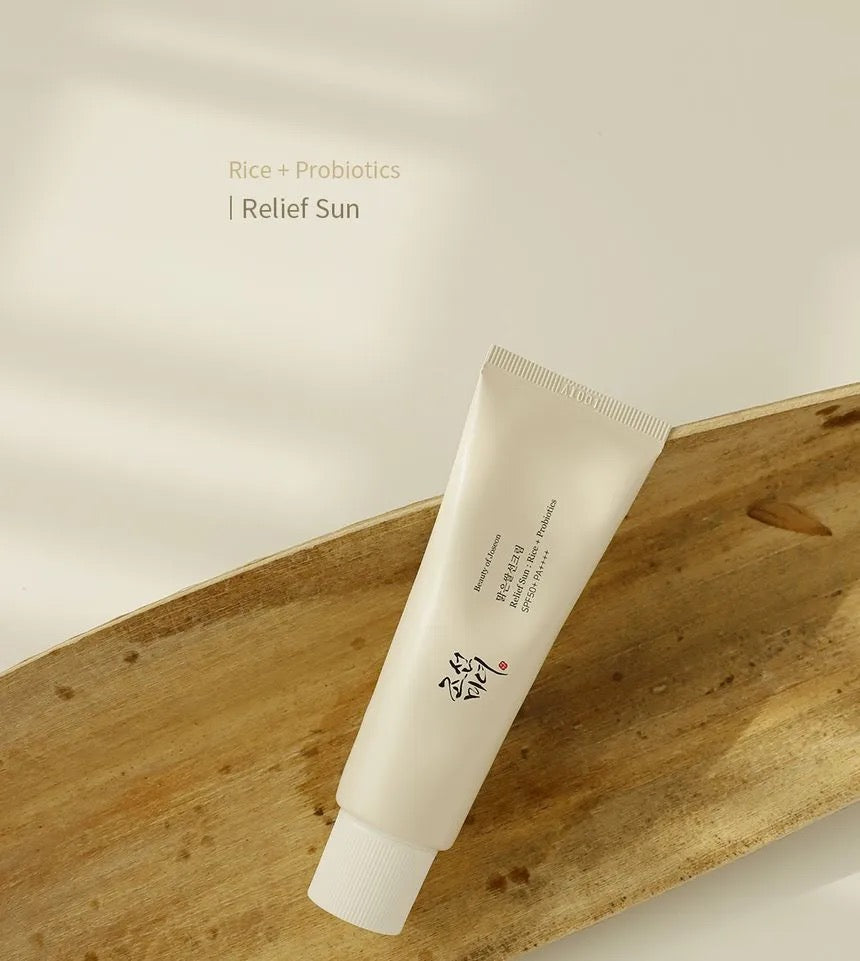 Tube of skincare product on a wooden surface with a neutral background