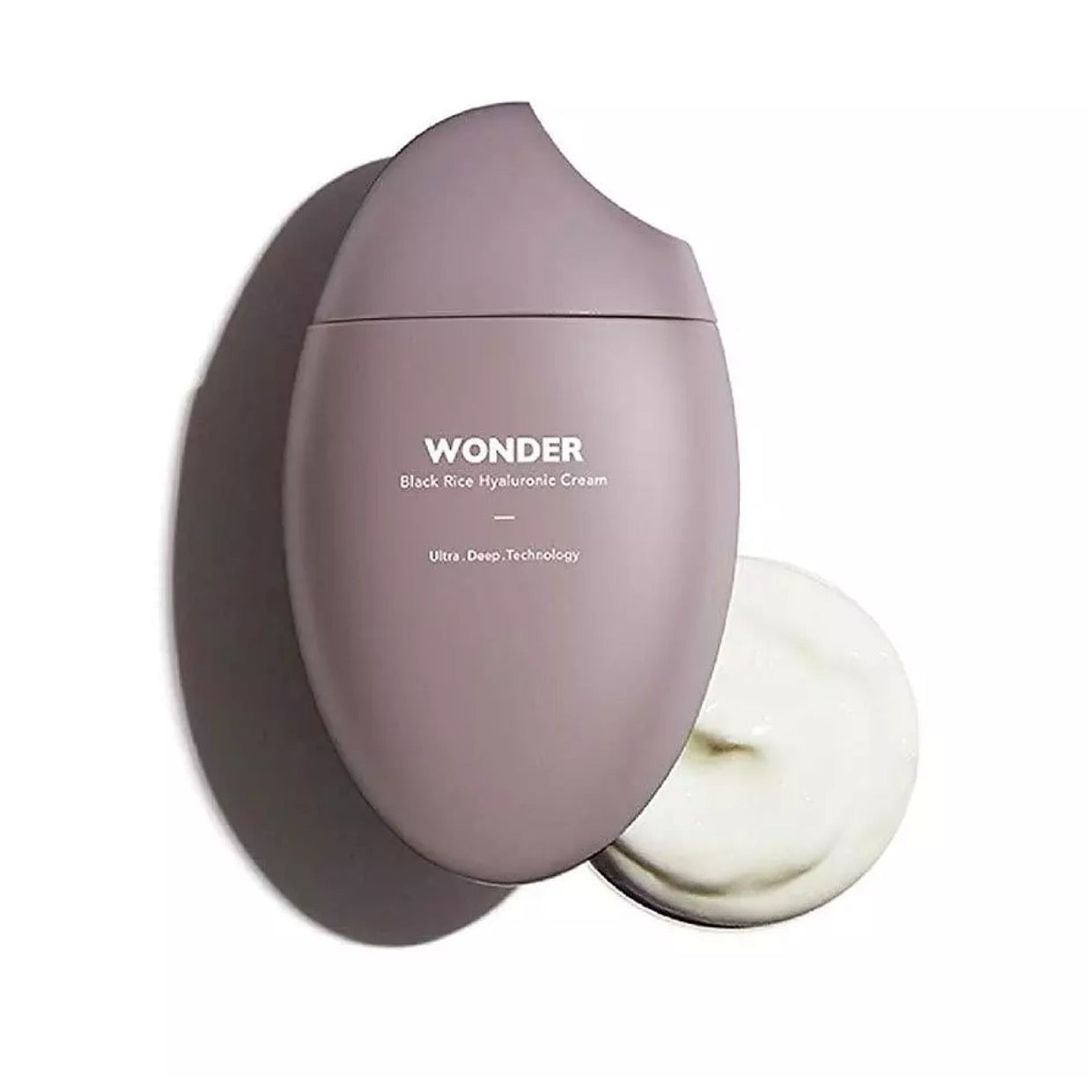 Purple skincare product with white cream on a white background
