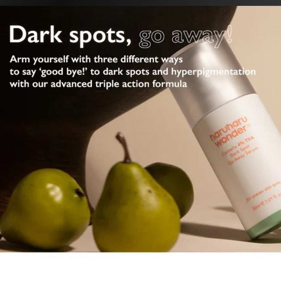 Skincare product with pears on a beige background and text about dark spots.