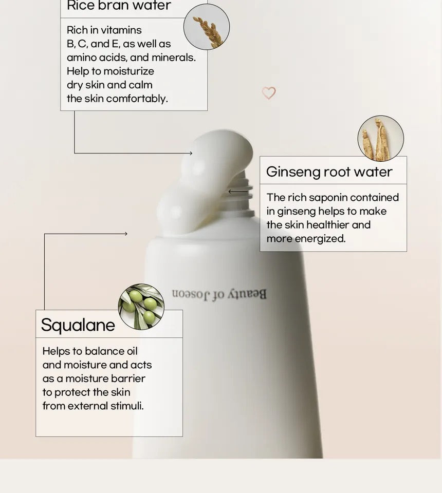 White bottle with text about rice bran water, ginseng root water, and squalane on a light pink background.