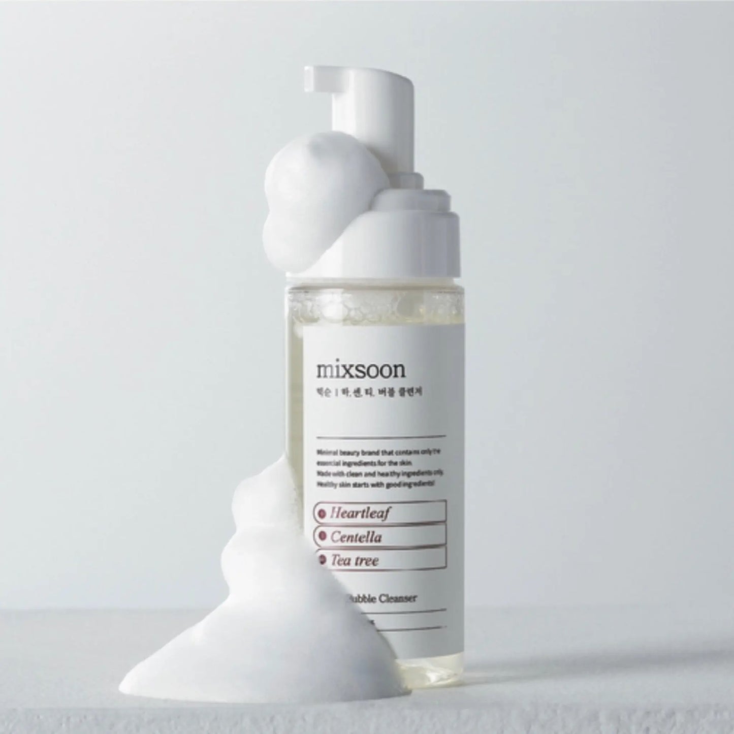 Skincare bottle with 'mixsoon' branding on a light gray background