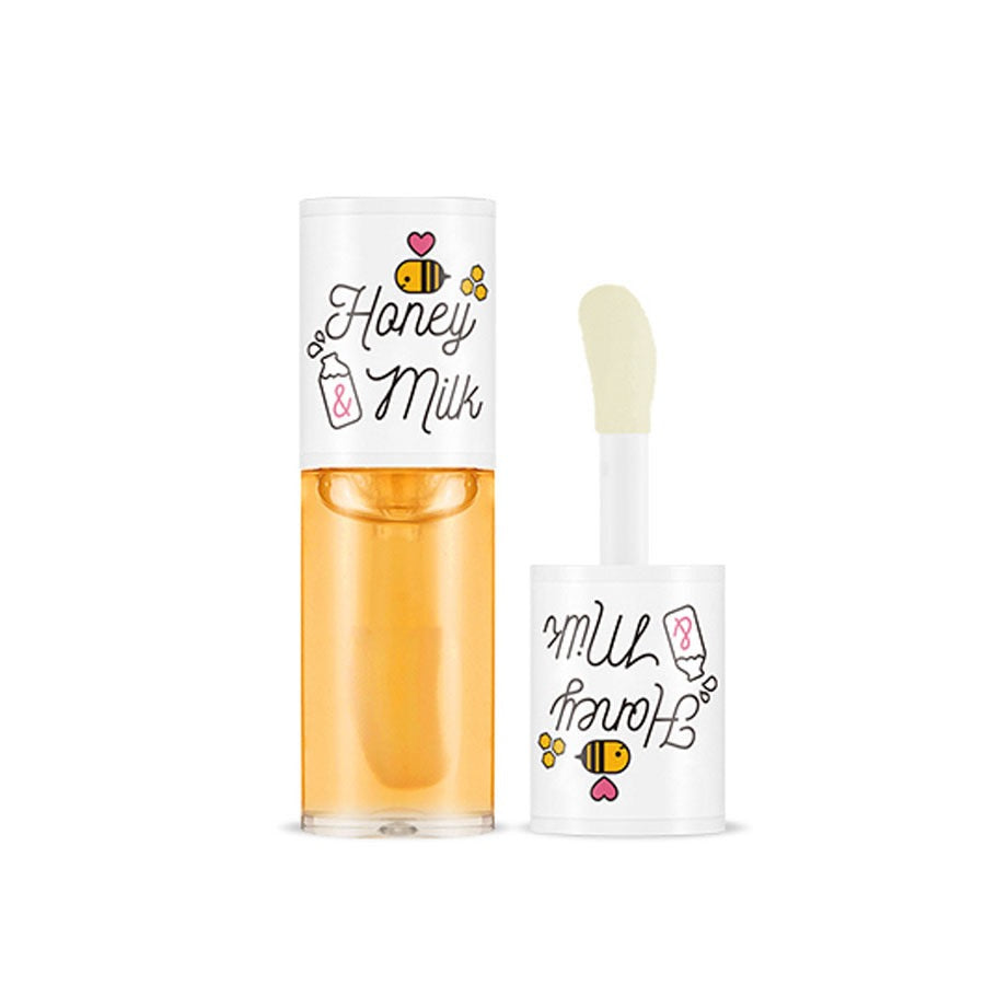 Two bottles labeled 'Honey Milk' with a white background