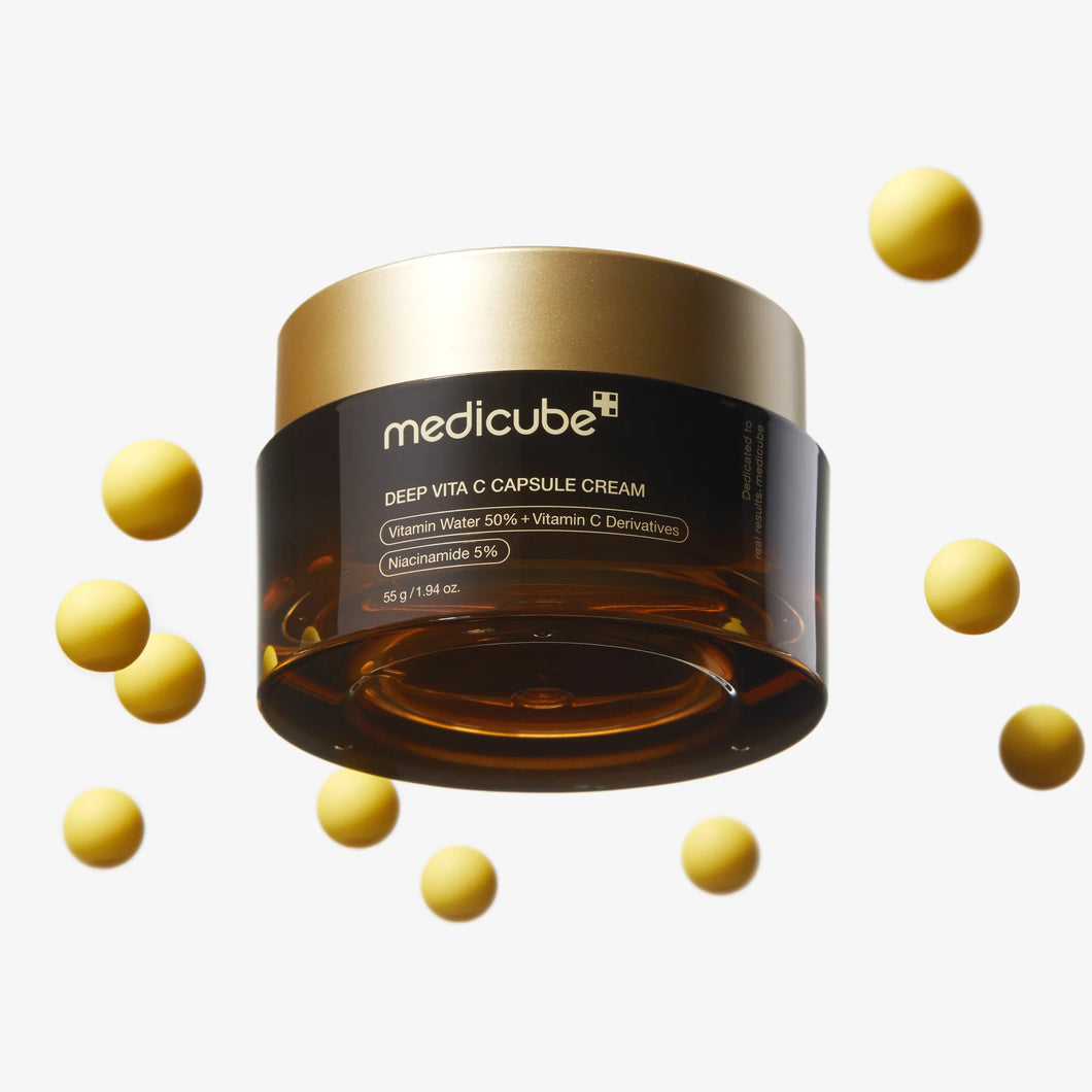 Medicube Deep Vita C Capsule Cream jar with capsules on a white background
