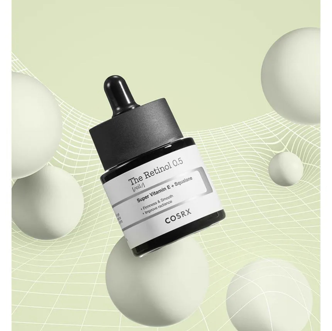 Cosrx skincare serum bottle on a green background with geometric shapes