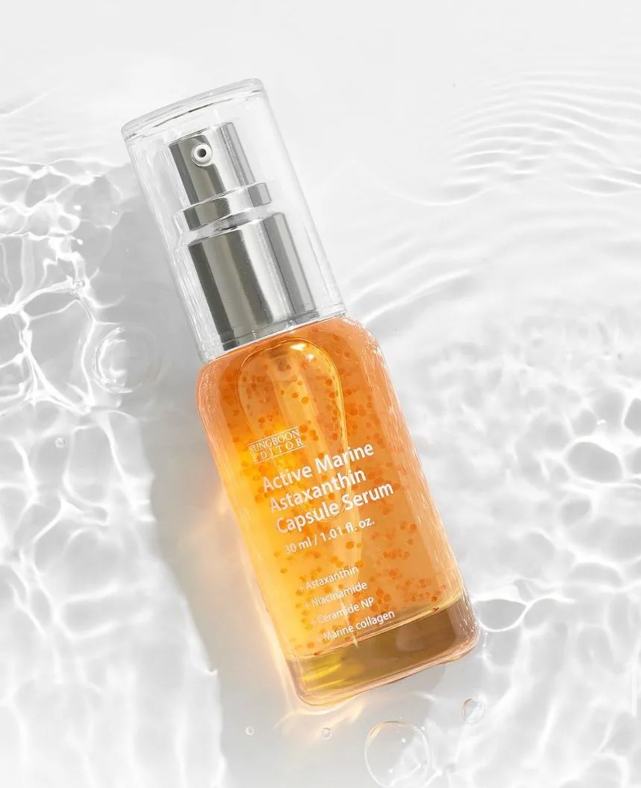 Serum bottle with a dropper on a textured white background