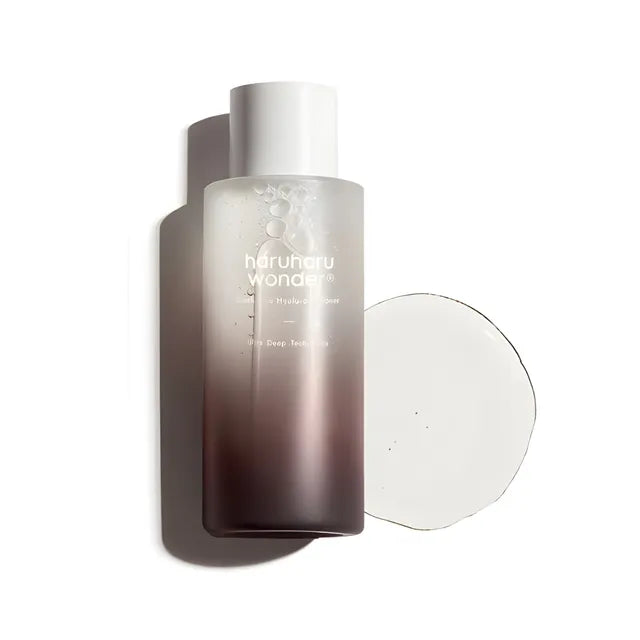 Skincare bottle with gradient design and visible brand name on a white background