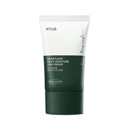 Green sun cream tube with white cap on a white background