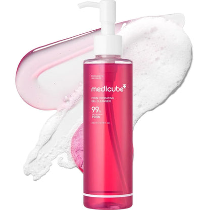 Pink bottle of Medicube cleanser with pump and foam on a white background