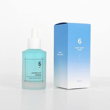 Skincare serum bottle with gradient packaging and matching box on a white background
