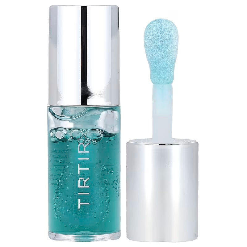 Skincare serum bottle with applicator on a white background
