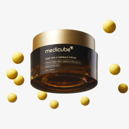 Medicube Deep Vita C Capsule Cream jar with capsules on a white background