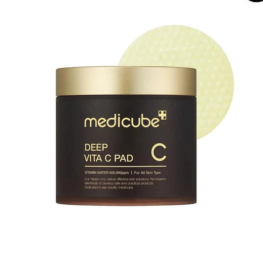 Medicube Deep Vita C Pad with a gold lid on a white background
