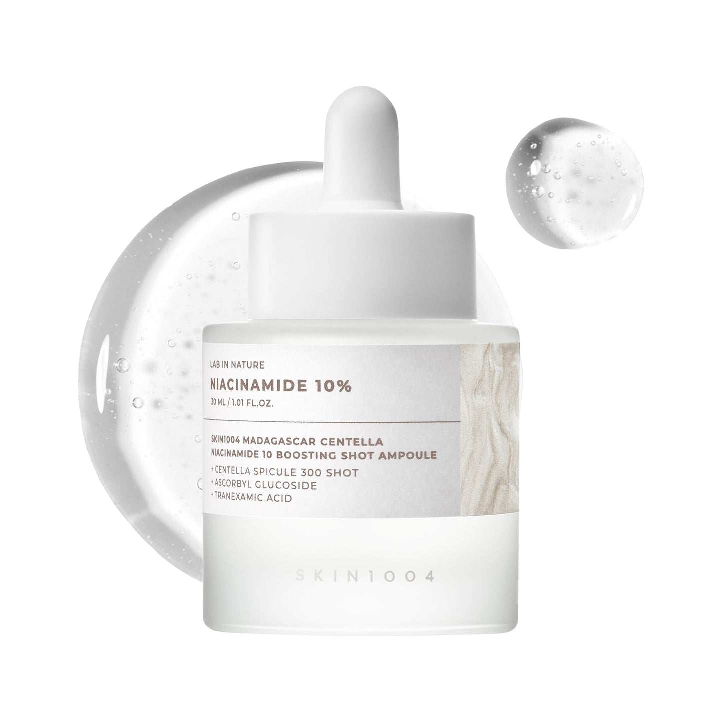 Skincare ampoule with 'Niacinamide 10%' label on a white background