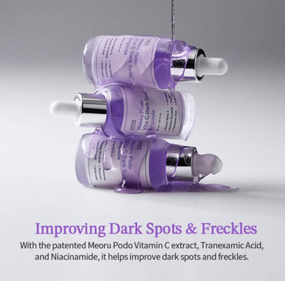 Three purple skincare serum bottles with droppers on a gray background, featuring text about improving dark spots and freckles.